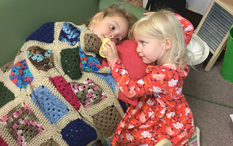 happy girls playing together at a Preschool & Childcare Serving Salt Lake City, UT