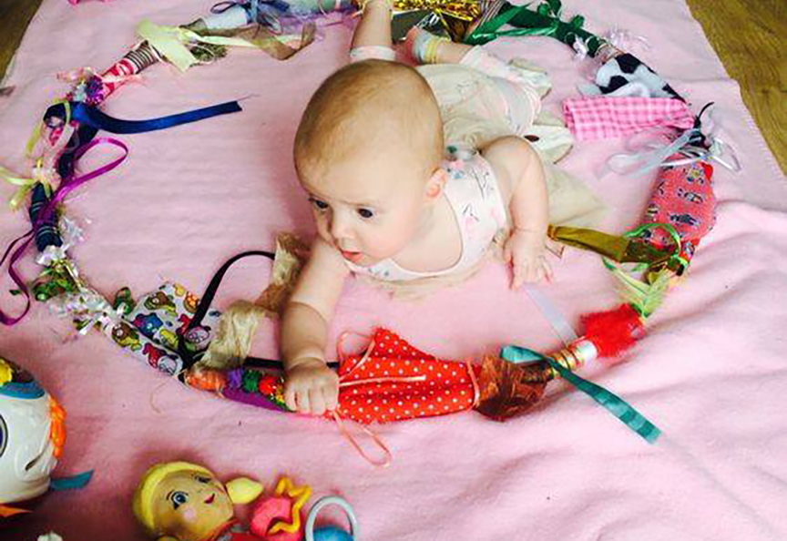 infant playing with toys at a Preschool & Childcare Serving Salt Lake City, UT